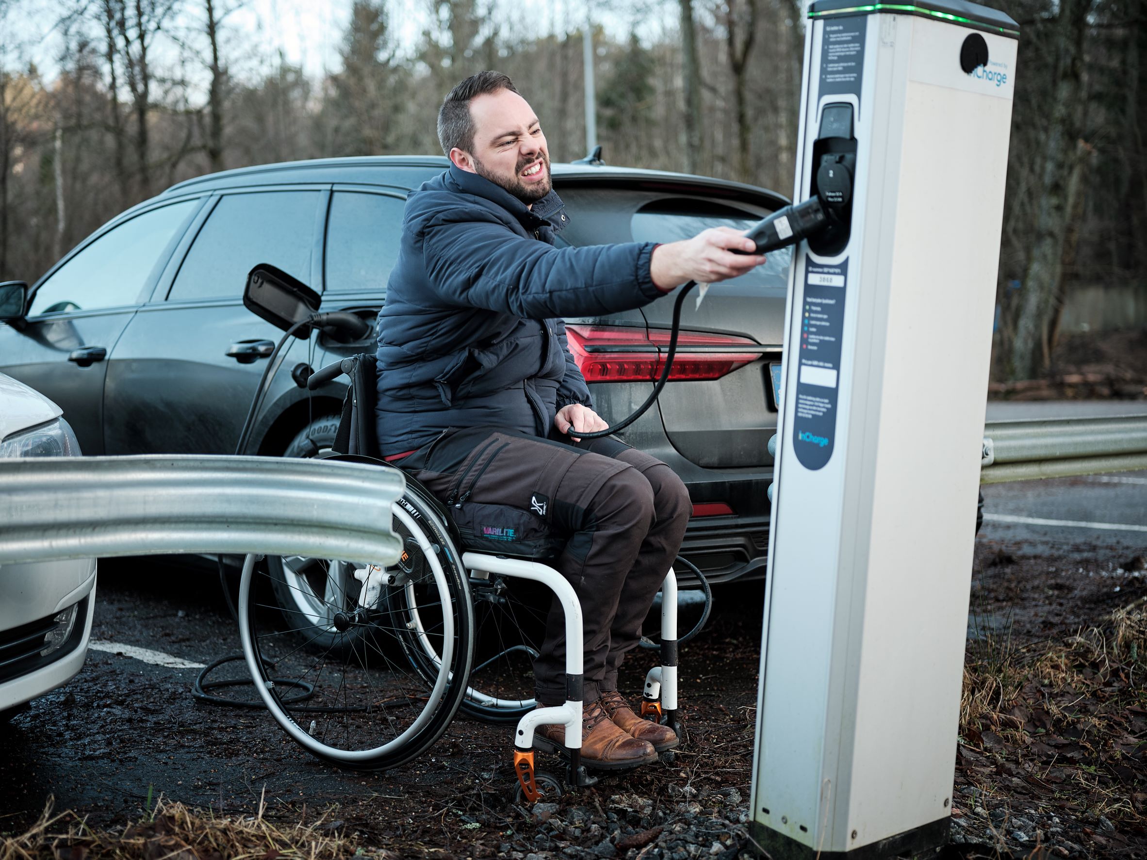 Wheelchair user with inaccessible charging station