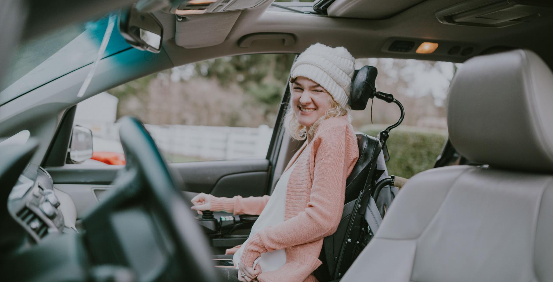 Lady in adapted mobility car