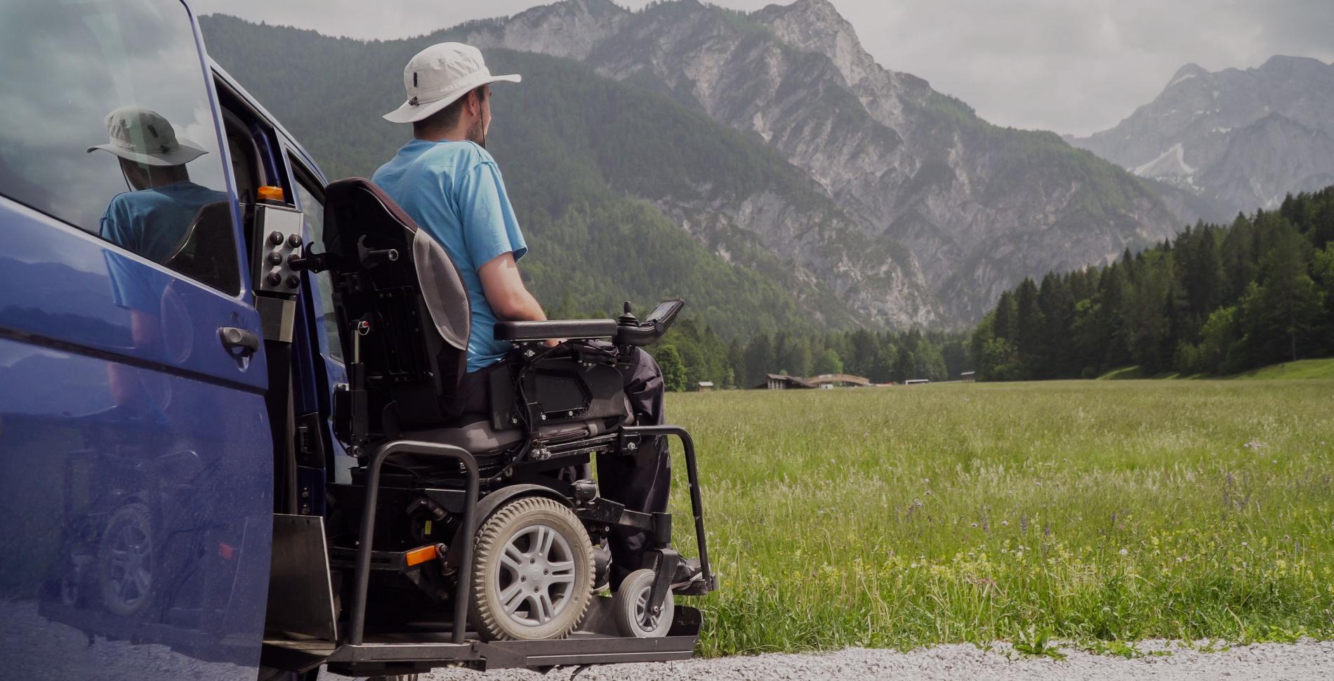 Man in Wheelchair adapted car lift